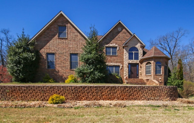 traditional home featuring brick siding