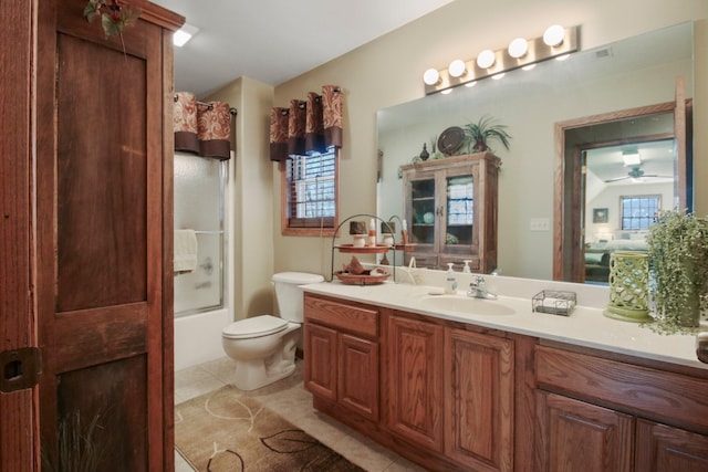 bathroom with shower / bathtub combination, vanity, toilet, and tile patterned floors