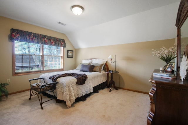 bedroom with visible vents, vaulted ceiling, light carpet, and baseboards