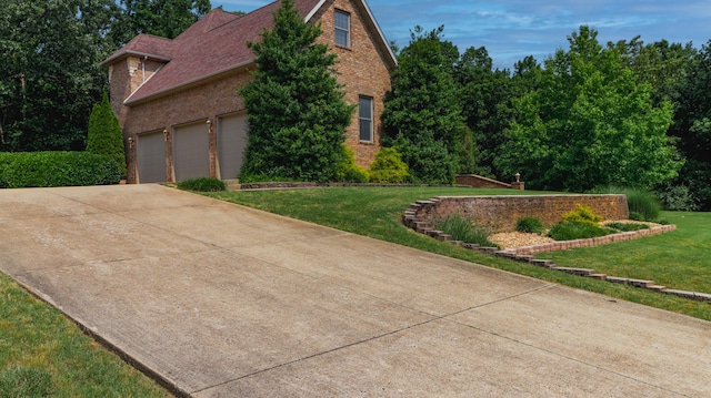 1165 Susan Dr, West Plains, MO 65775 - view of side of property featuring brick siding, a yard, concrete driveway, and a garage