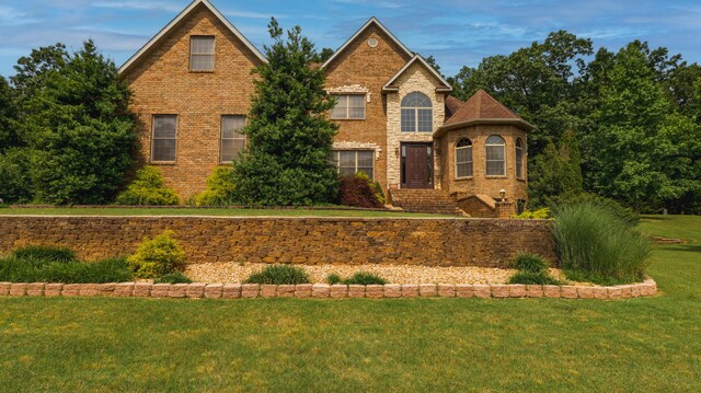 1165 Susan Dr, West Plains, MO 65775 - view of front of house with a front lawn and brick siding
