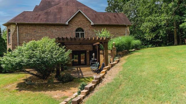 1165 Susan Dr, West Plains, MO 65775 - view of home's exterior featuring brick siding, a yard, french doors, and roof with shingles