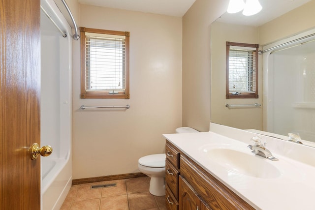 bathroom featuring toilet, tile patterned flooring, visible vents, and a wealth of natural light