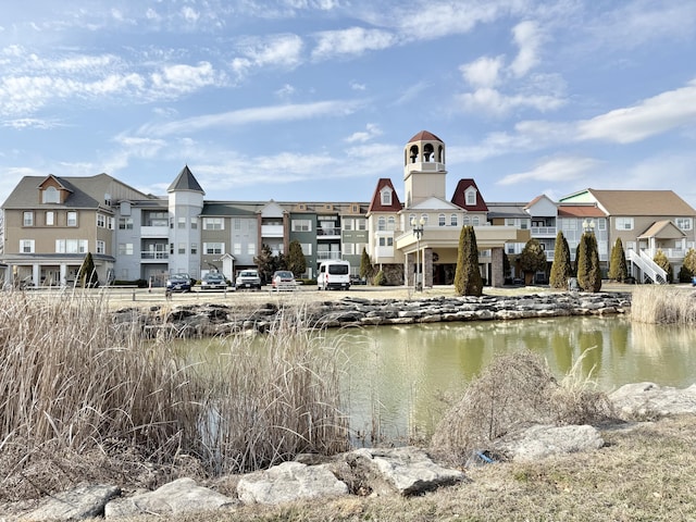 exterior space featuring a water view and a residential view