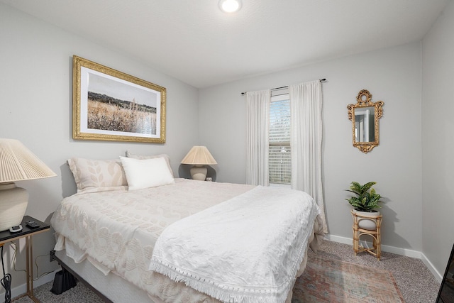 carpeted bedroom with baseboards