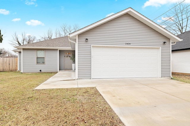 ranch-style home with a shingled roof, concrete driveway, fence, a garage, and a front lawn