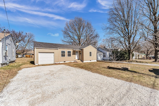 ranch-style home featuring a garage, driveway, crawl space, and entry steps