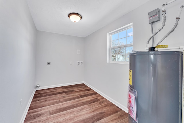 utility room featuring water heater