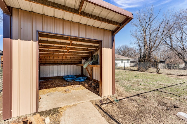 exterior space with an outbuilding and fence