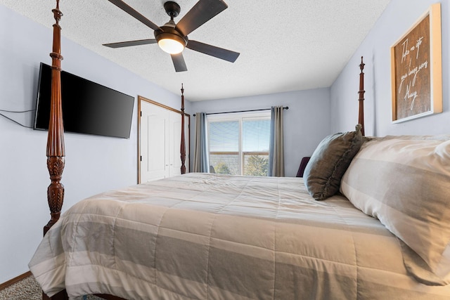 bedroom with a closet, ceiling fan, and a textured ceiling