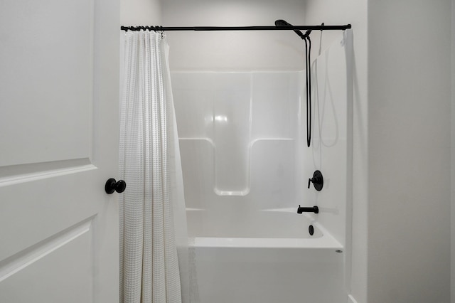 full bath featuring shower / bath combo with shower curtain