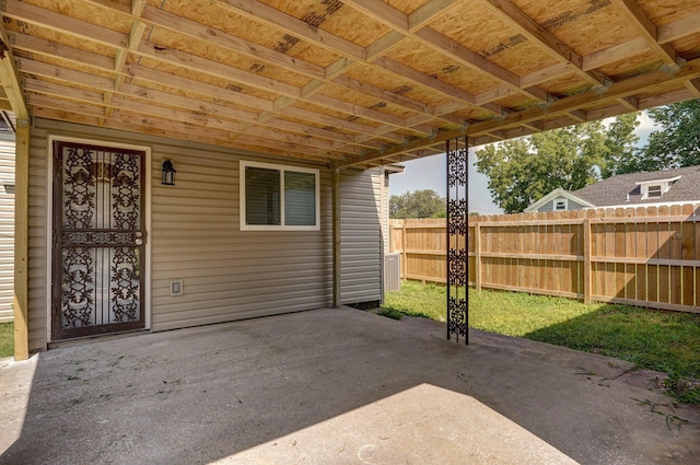 view of patio / terrace featuring fence