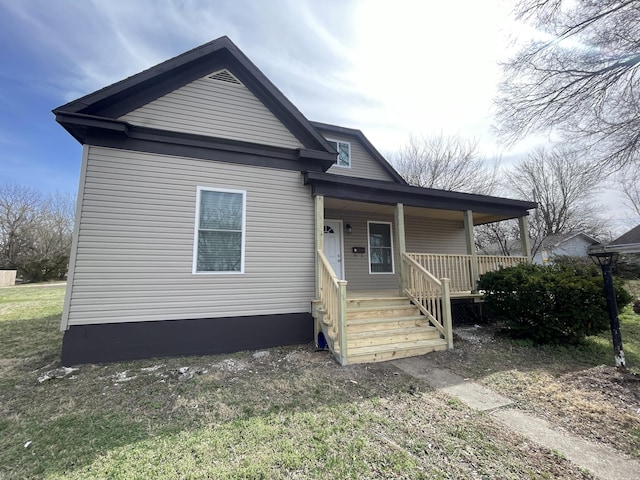 1202 N National Ave, Springfield, MO 65802 - view of front of property featuring a porch and a front lawn