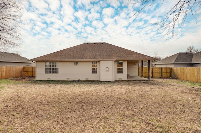 rear view of house with a patio, crawl space, a fenced backyard, and roof with shingles