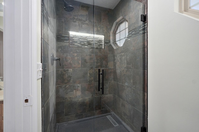 full bath with a shower stall