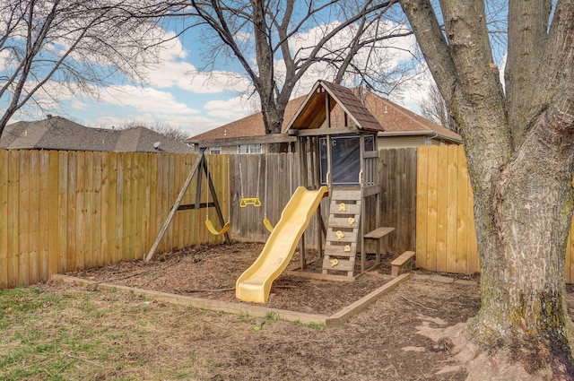 view of playground featuring fence