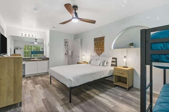 bedroom with ceiling fan and wood finished floors