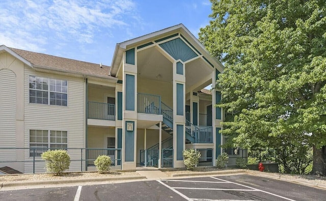 view of property featuring uncovered parking