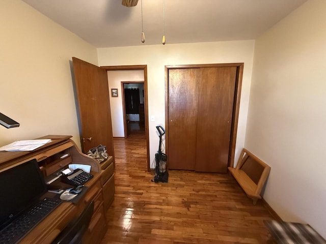 office area featuring baseboards and wood finished floors