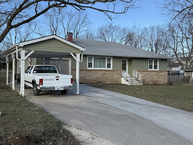 single story home with fence, stone siding, concrete driveway, roof with shingles, and a chimney