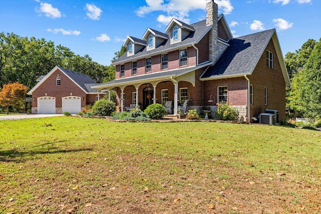 view of front of property with a porch, brick siding, a garage, and a front lawn