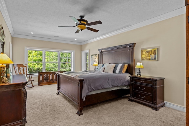 bedroom with ornamental molding, light carpet, a textured ceiling, and baseboards