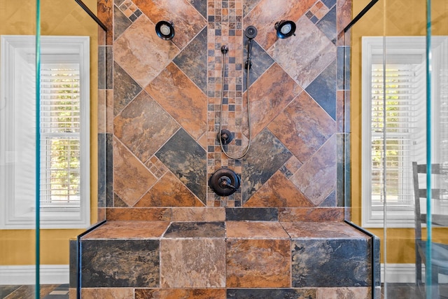 interior details with a tile shower