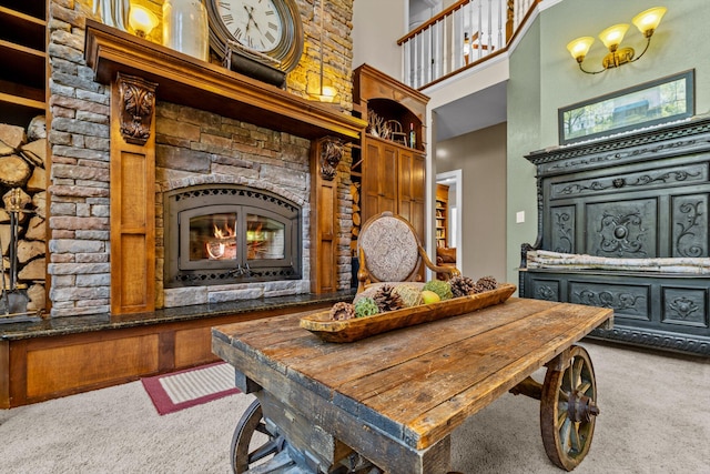 carpeted dining space with a high ceiling