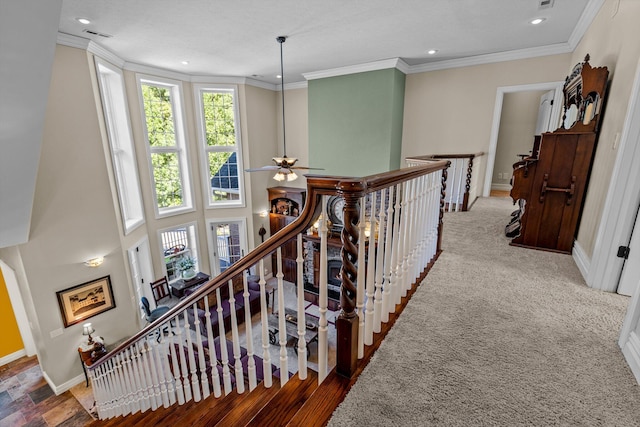 hall featuring ornamental molding, recessed lighting, an upstairs landing, and baseboards