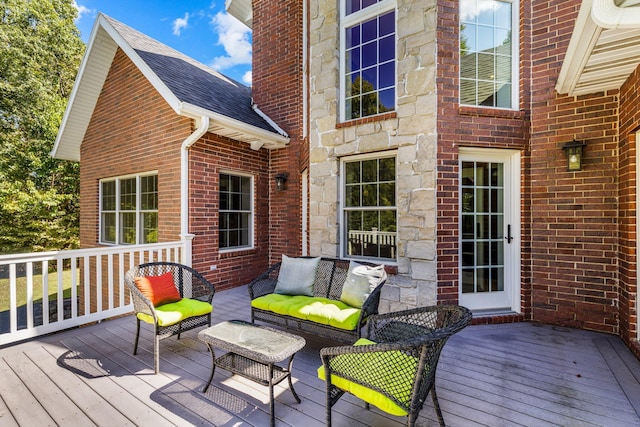 wooden deck featuring an outdoor living space