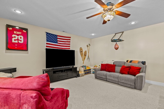 living room featuring carpet floors, recessed lighting, a ceiling fan, a textured ceiling, and baseboards