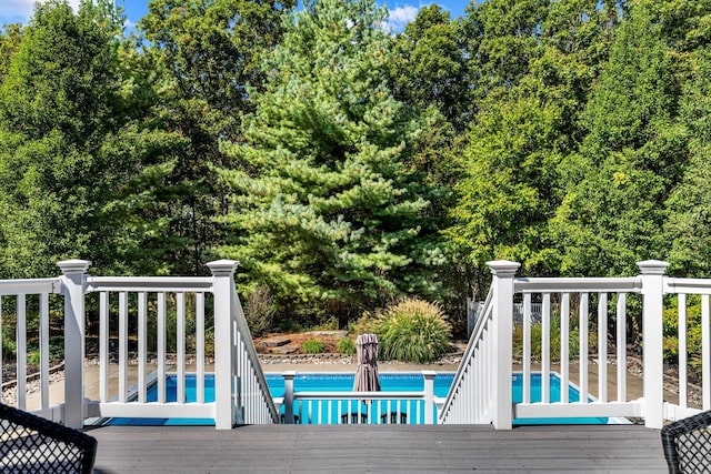 wooden deck with an outdoor pool