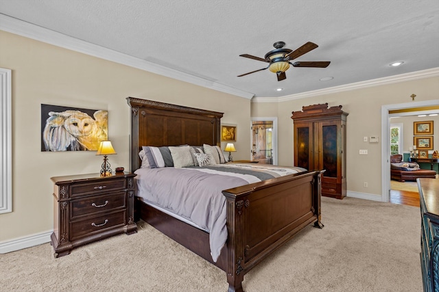 bedroom with light colored carpet, crown molding, baseboards, and ceiling fan