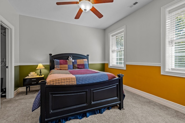 bedroom with baseboards, visible vents, ceiling fan, and carpet flooring