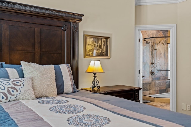 bedroom featuring ornamental molding and ensuite bath