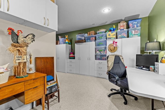 office featuring visible vents and a textured ceiling