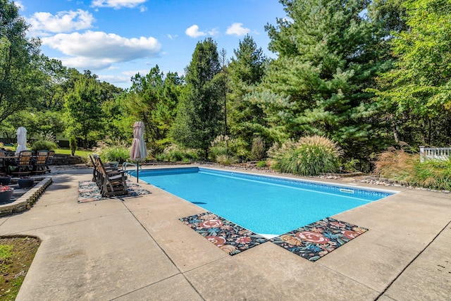 outdoor pool featuring a patio area