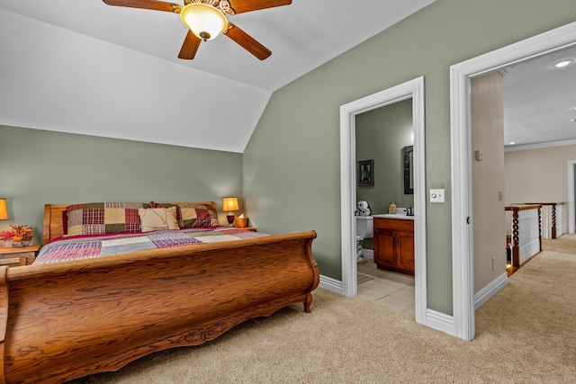 bedroom featuring lofted ceiling, light colored carpet, a ceiling fan, connected bathroom, and baseboards