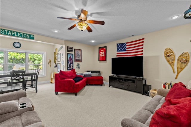 living room with a textured ceiling, carpet, and recessed lighting