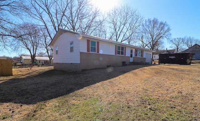 ranch-style house with brick siding and a front yard