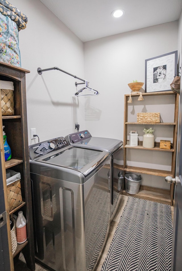 clothes washing area featuring recessed lighting, laundry area, and independent washer and dryer