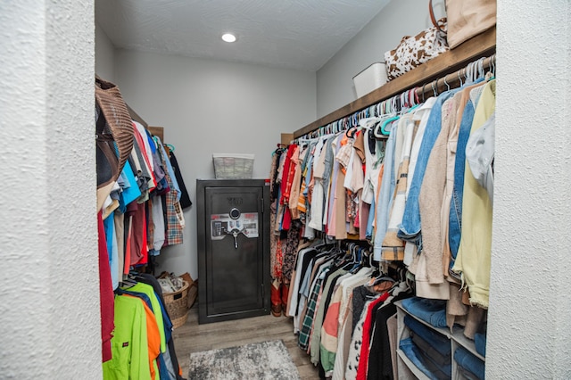 walk in closet featuring wood finished floors