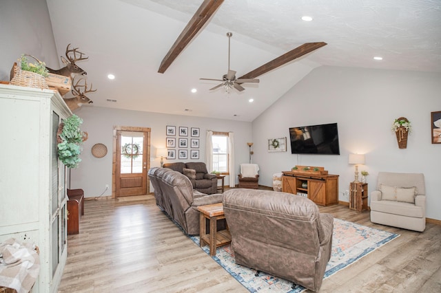 living room with lofted ceiling, baseboards, light wood finished floors, and recessed lighting