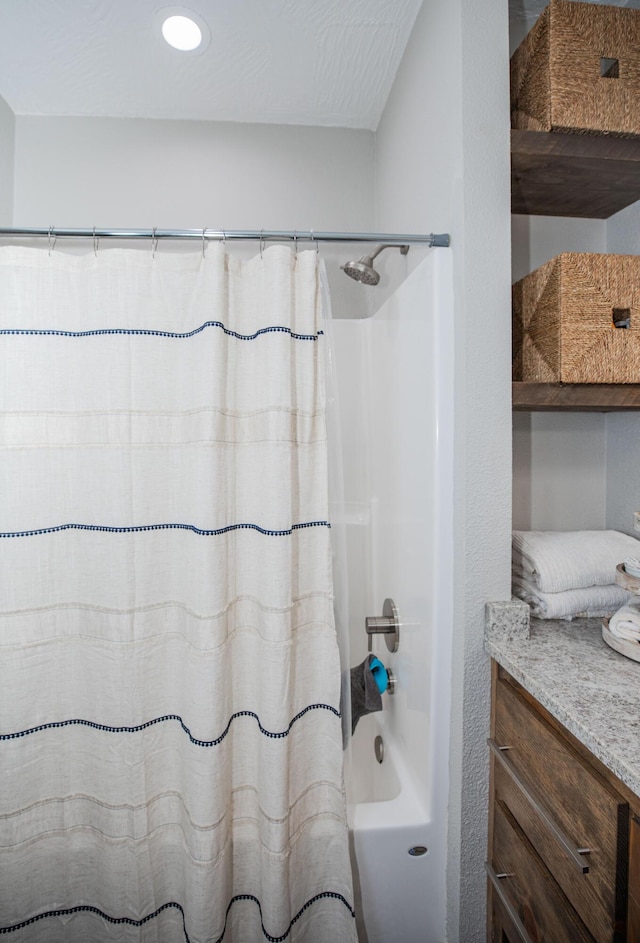 full bath with vanity and shower / tub combo with curtain