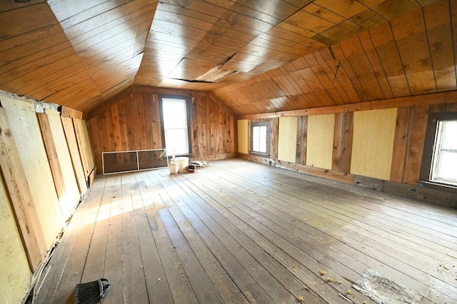 additional living space featuring lofted ceiling, light wood finished floors, and wood ceiling