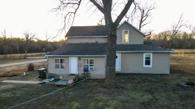 back of property featuring cooling unit