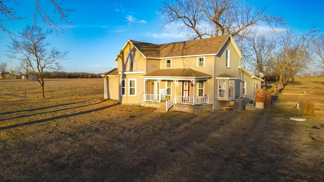 back of property featuring a porch