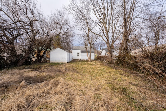 view of yard featuring an outbuilding and a storage unit