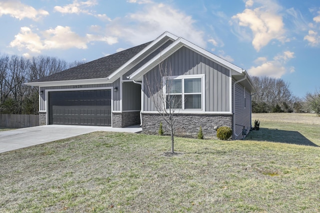 view of front facade featuring a garage, driveway, stone siding, board and batten siding, and a front yard