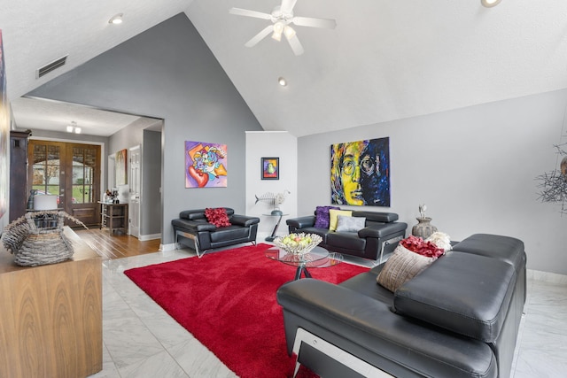 living room with visible vents, ceiling fan, marble finish floor, french doors, and high vaulted ceiling